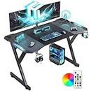 DLONGONE 120x60cm Gaming Desk with LED Lights, Computer Gaming Desk with Carbon Fibre Surface,Sturdy PC Desk and Home Office with Headphone Hook and Cup Holder, Black