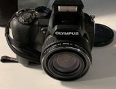 Great OLYMPUS SP-565UZ camera. Gently Used + accessory/cleaning kit & case