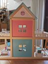 wooden dollhouse with bears and dog 