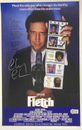 Foto póster de película Fletch de 11x17 firmada por Chevy Chase BAJO