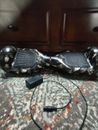 Hoverboard With Charger, Used Has A Small Crack On The Light Cover.