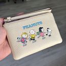 Coach Bags | New Coach X Peanuts Corner Zip Wristlet With Snoopy And Friends Motif | Color: Red | Size: 6 1/4" (L) X 4" (H) X 1/2" (W)