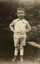 c1910 Photo Little Boy in Shorts Leggings & High Shoes Long Sleeves & Tie RPPC