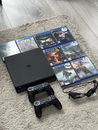 Sony PS 4 (slim) console, with controllers and games.