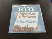 UNLIMITED TOUCH - I hear music in the streets/In the middle 7'' 1981 - GERMANY