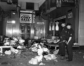 Damaged dummies are strewn outside this wrecked store in West 125t .. Old Photo