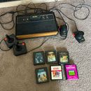Restored Atari 2600 with 2 Joys, Paddles, and 7 games. PacMan, Defender, Asteroi