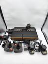 Atari 2600 Woodgrain Console Paddles & Joysticks