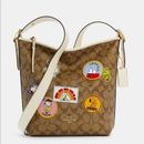 Coach Bags | Coach X Peanuts Val Duffle In Signature Canvas | Color: Brown/White | Size: Os