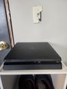 PS4 with 17 games and 4 controllers and wireless charging station