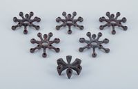Jens Harald Quistgaard for Dansk Designs, set of six candle holders in cast iron