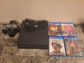 Sony PlayStation 4 (Black) + 4 Games/ Wireless controller/ Cables/ Charger 